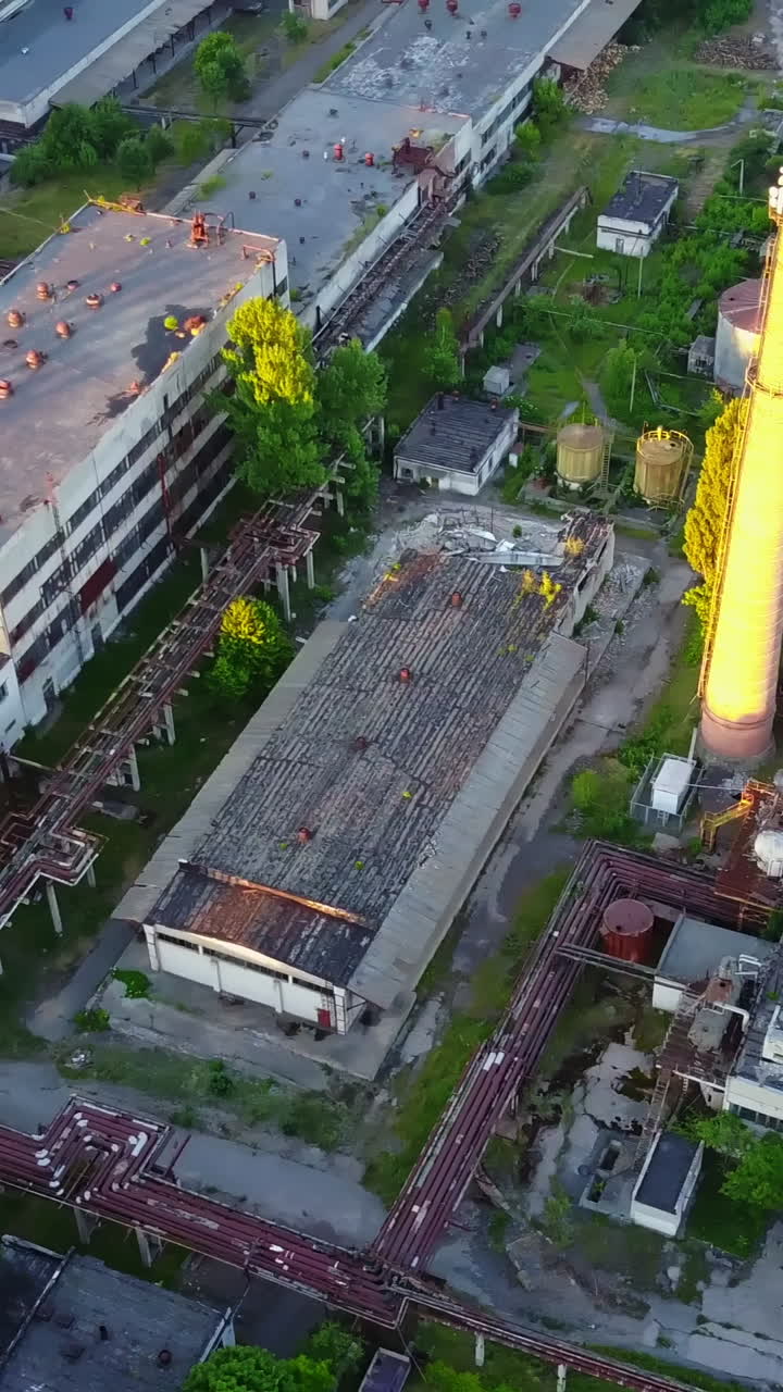 The Old Industrial Factory. The old derelict factory laying in countryside Vertical video