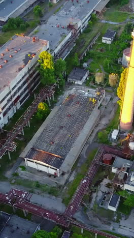 the old industrial factory. the old derelict factory laying in countryside vertical video