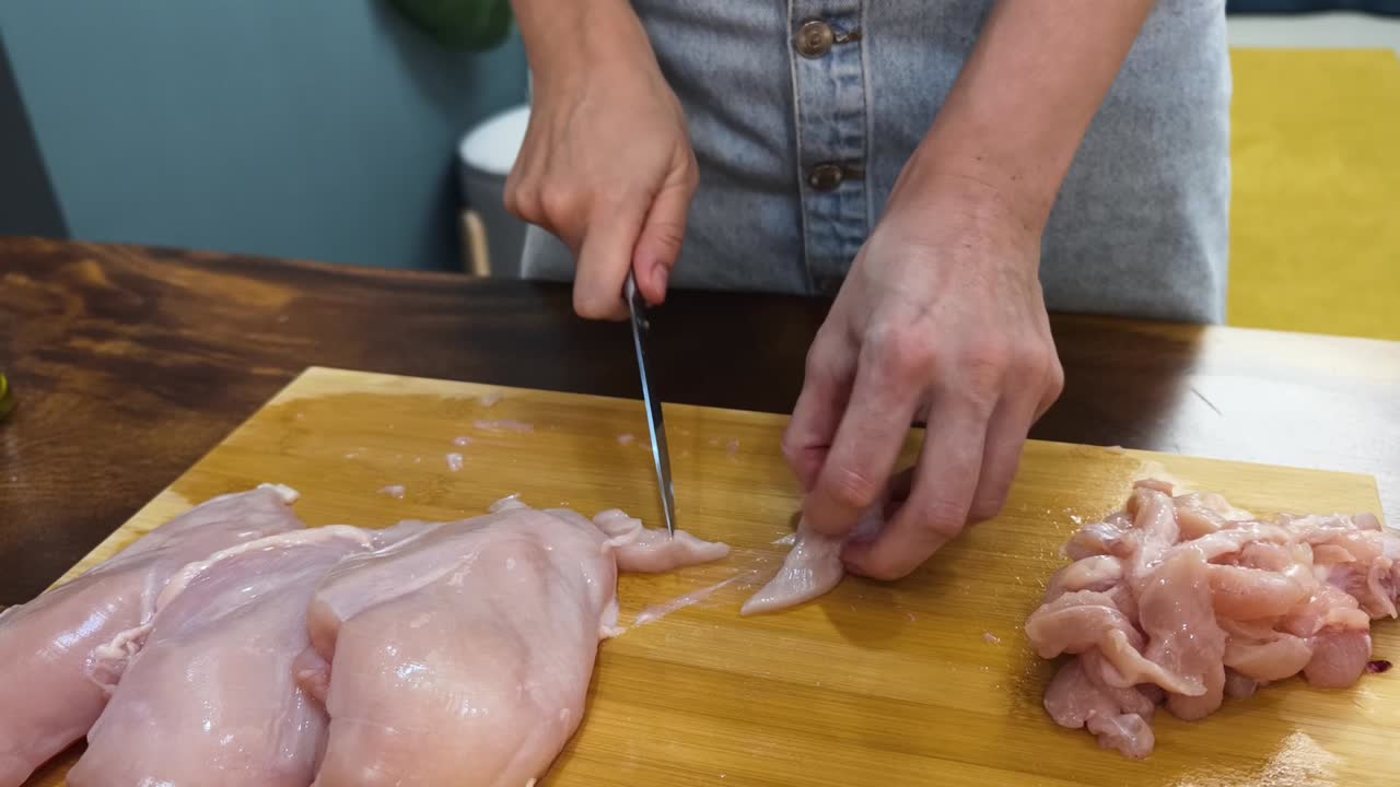 Cutting chicken breast into pieces