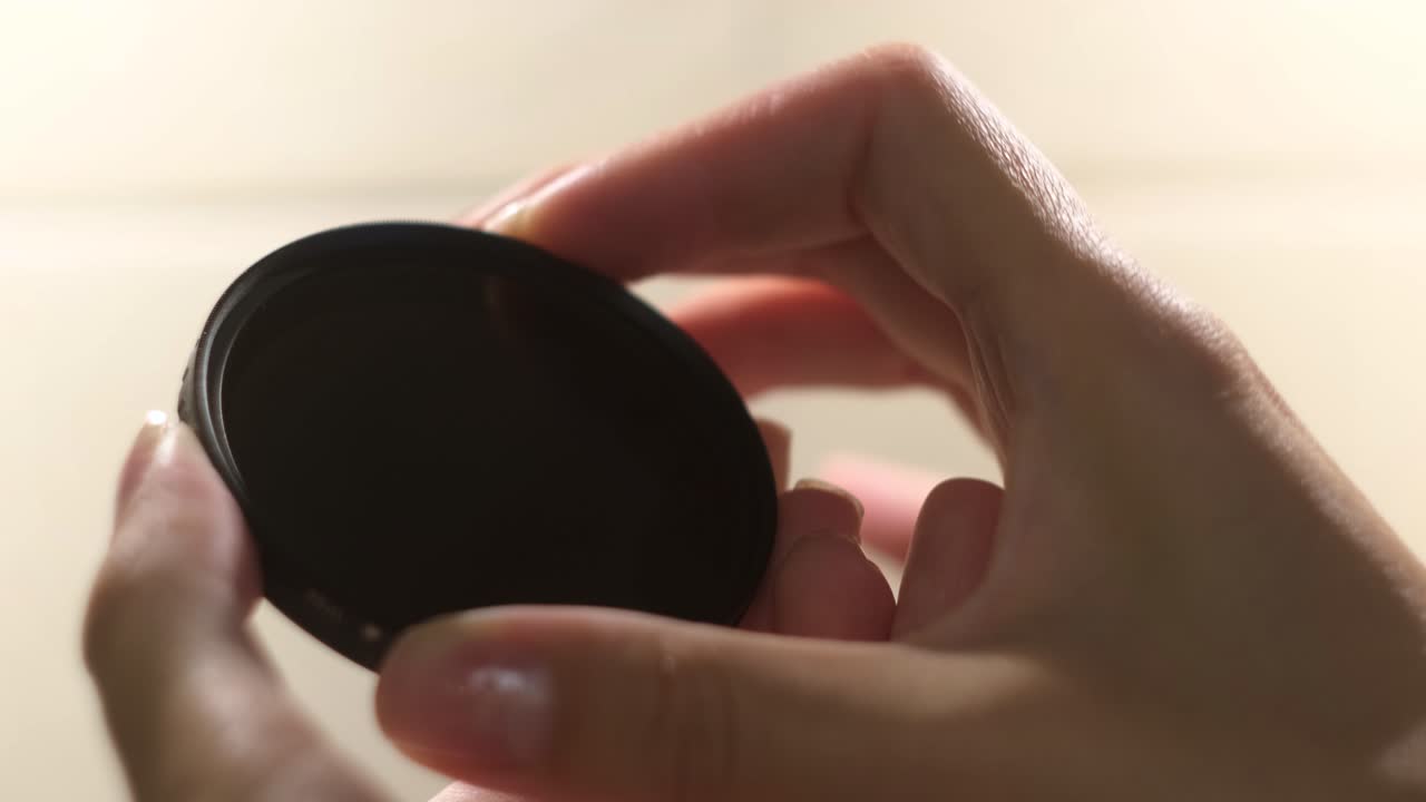 Hands Holding a Neutral Density Filter