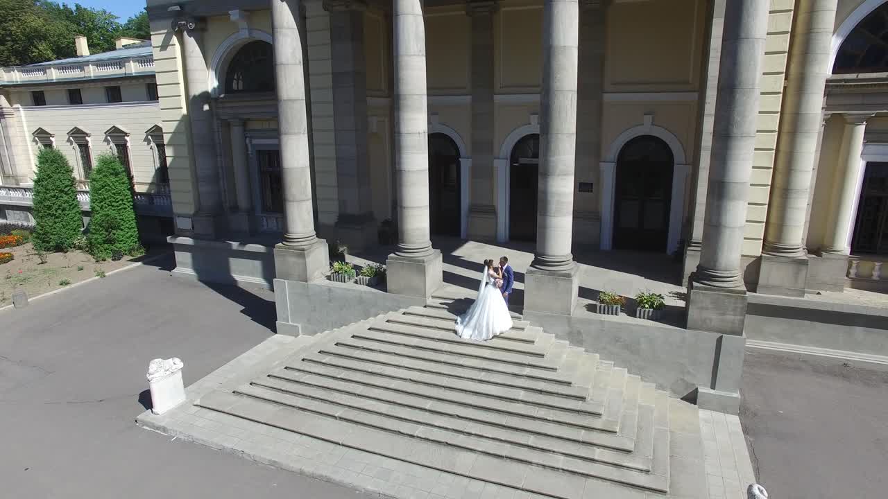 Romantic Sensual Moment. Aerial shot of a elegant wedding couple at old vintage house