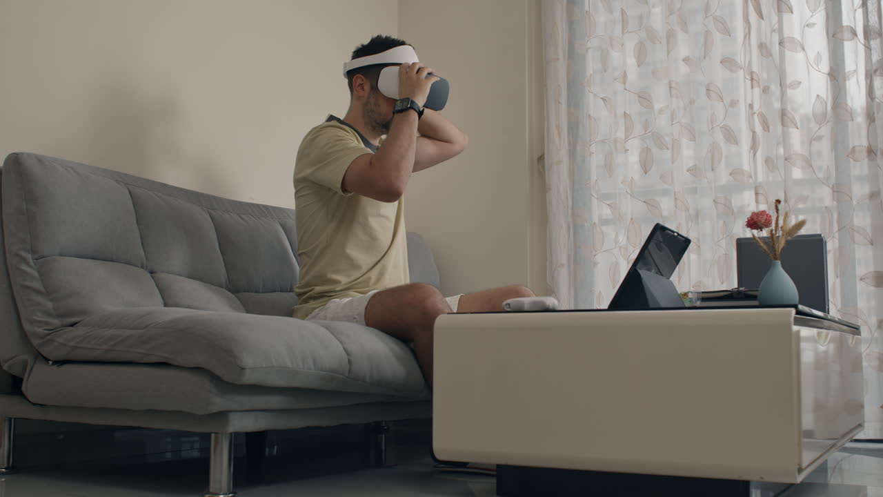 Frustrated programmer testing VR headset, interacting with virtual reality menu