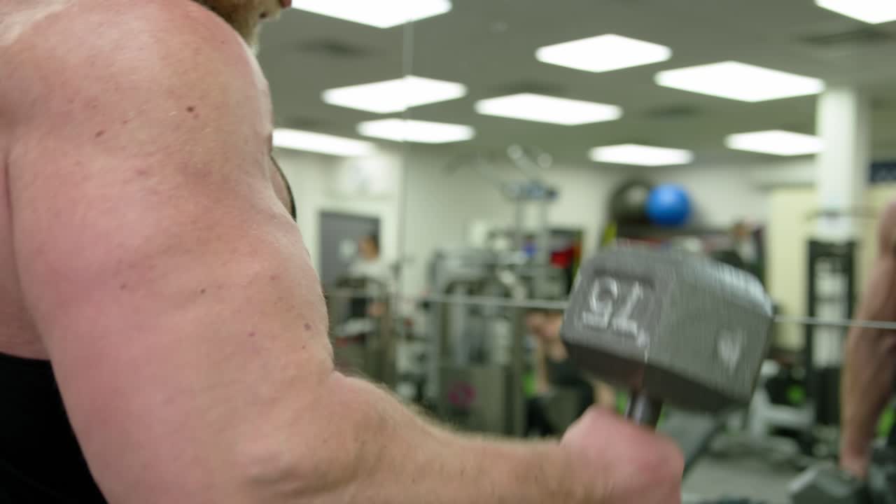 Powerful Man Exercising In Gym