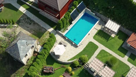 aerial: beautiful holiday villa and swimming pool in serbian mountains