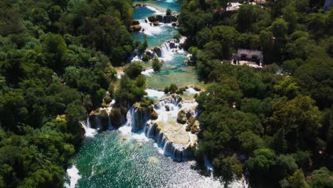 amazing aerial view panning down revealing lakes and waterfalls at krka national park in dalmatia, croatia filmed in 4k