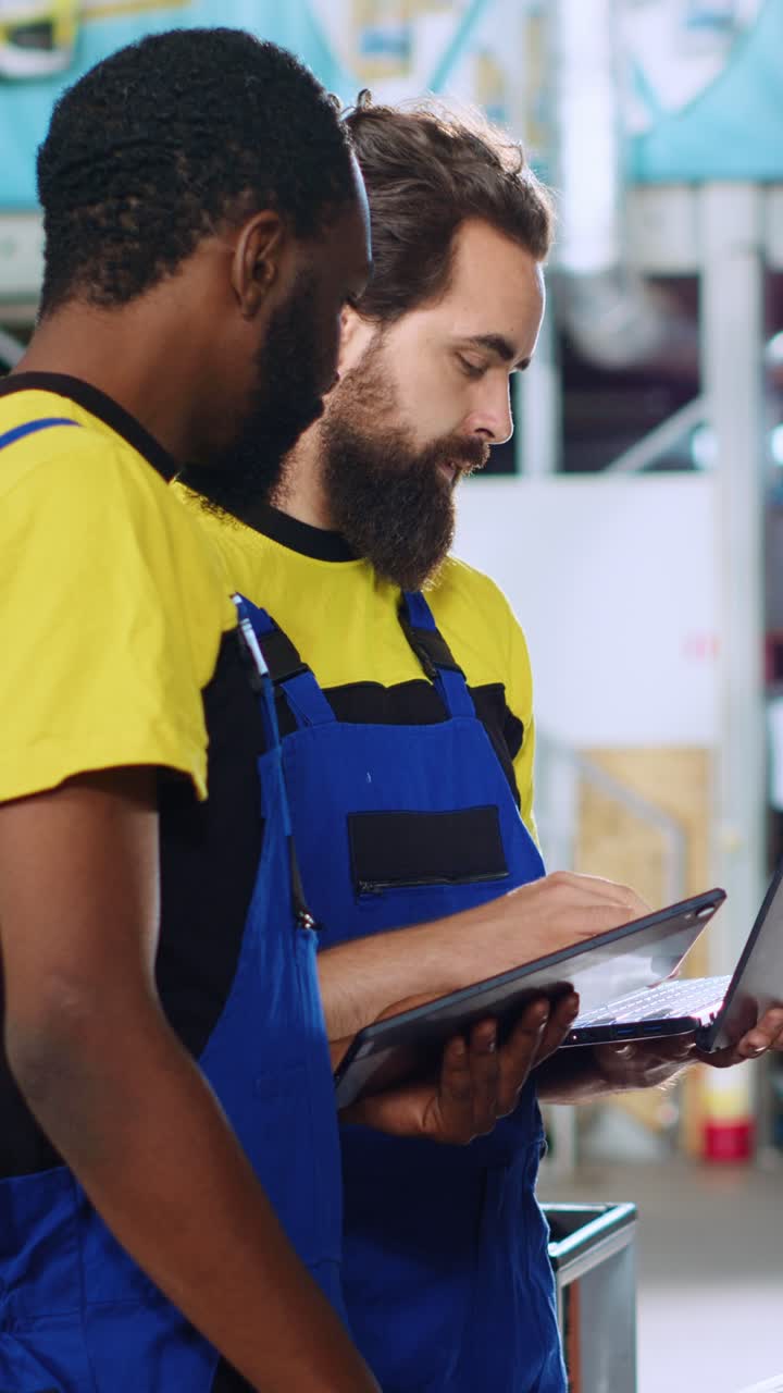Vertical video Repairmen in car service order new parts