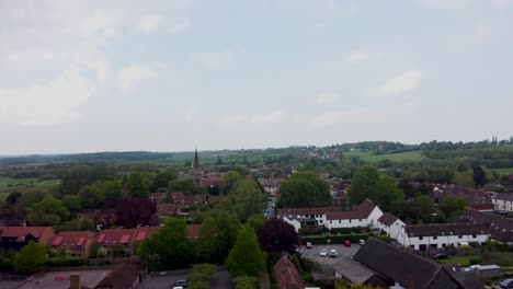 A-drone-reveal-shot-from-behind-trees