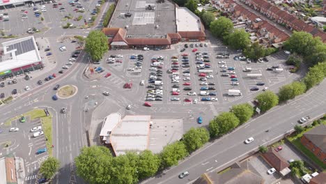 aerial view of a sainsbury's supermarket and busy parking lot