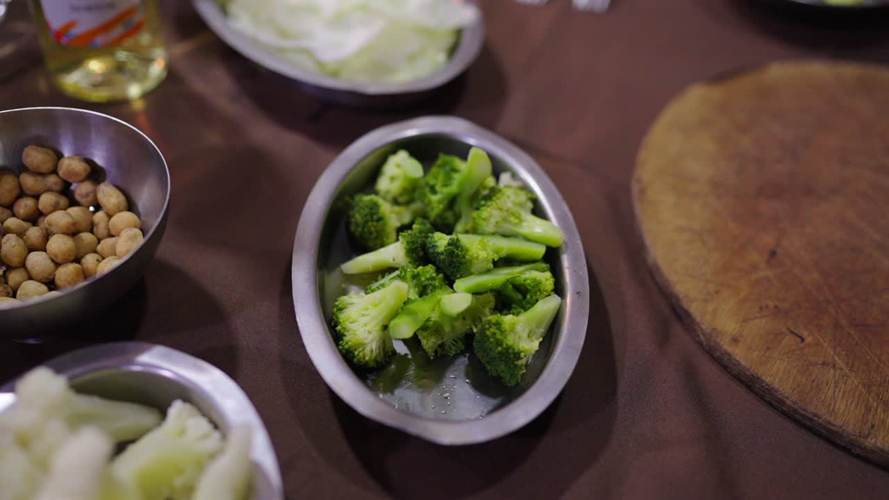 Broccoli with fresh ingredients ready for classic Bagna Cauda, a savory Italian dip.