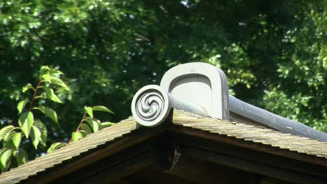 roof tiles with a shinto spiral motif on a japanese house