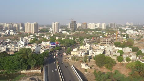 aerial view of a bustling cityscape with roads and buildings