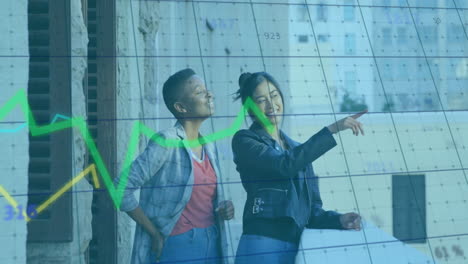 pointing at financial graph overlaying urban background, two people smiling