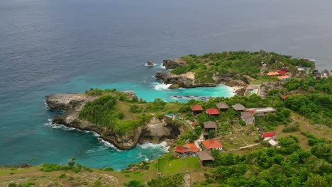 beautiful aerial of villas cliffside at blue lagoon in nusa ceningan island