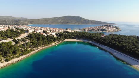 a drone shot of a beach in primosten, croatia