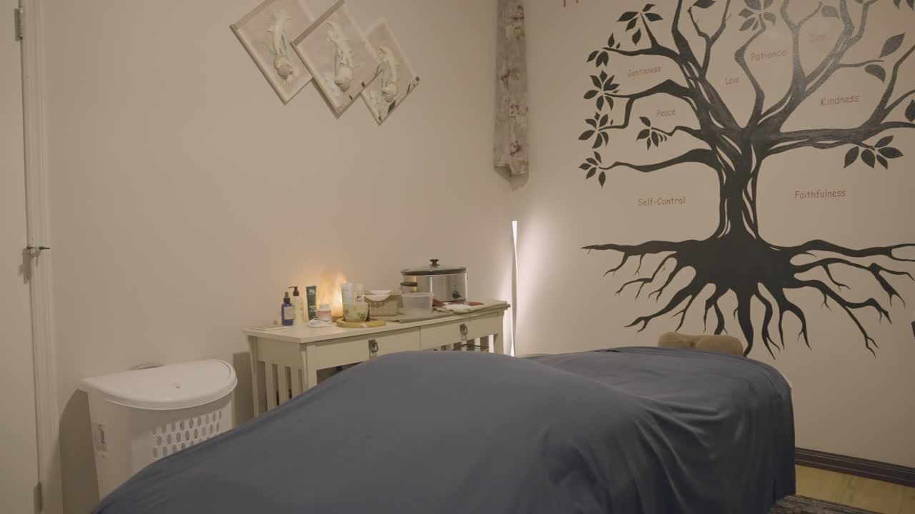 The serene atmosphere of the massage room adorned with a stunning graffiti mural is clearly visible.