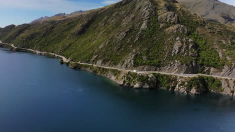 aerial reveal of winding road and popular scenic spot, queenstown, new zealand