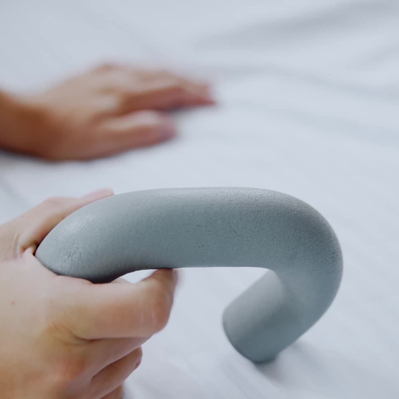 Female hands holding for a handrail. Pregnant lady is having emergency button for calling medical personnel. Close up