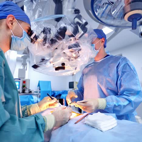 surgeons team at work in operating room