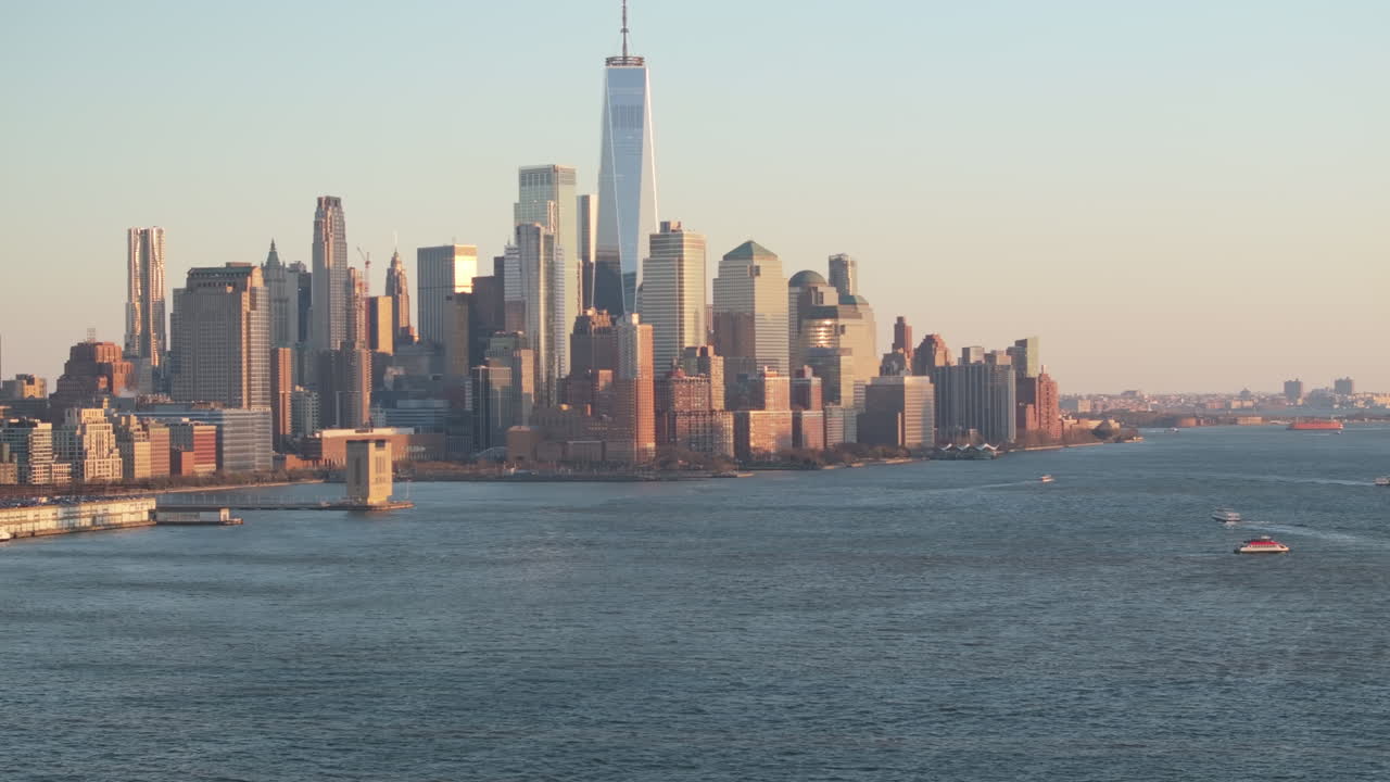 Aerial view of The World Trade Center at dusk. Shot along The Hudson River in New Jersey.