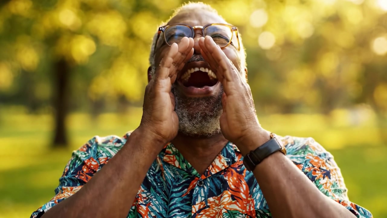 A joyful elderly man is captured in two vibrant frames, showcasing sincere laughter and happiness amidst a sunny, green park setting filled with life and nature's beauty.
