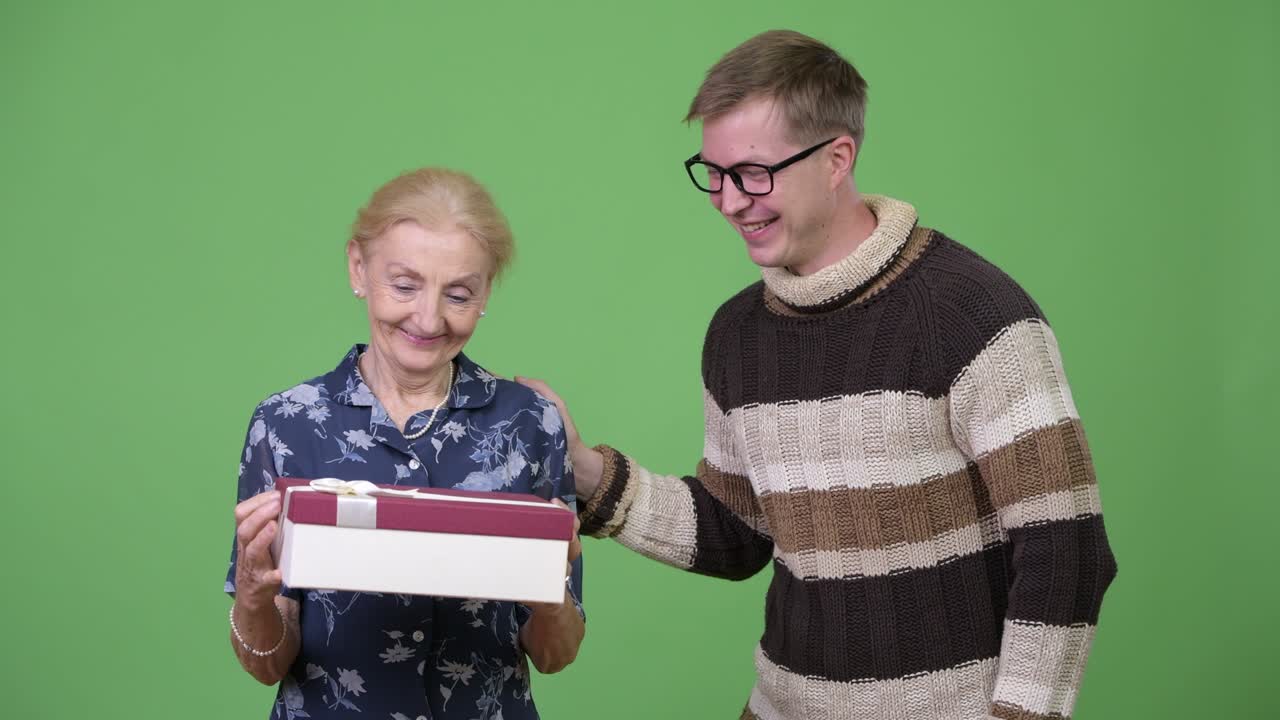 Grandmother getting gift from grandson with nothing inside