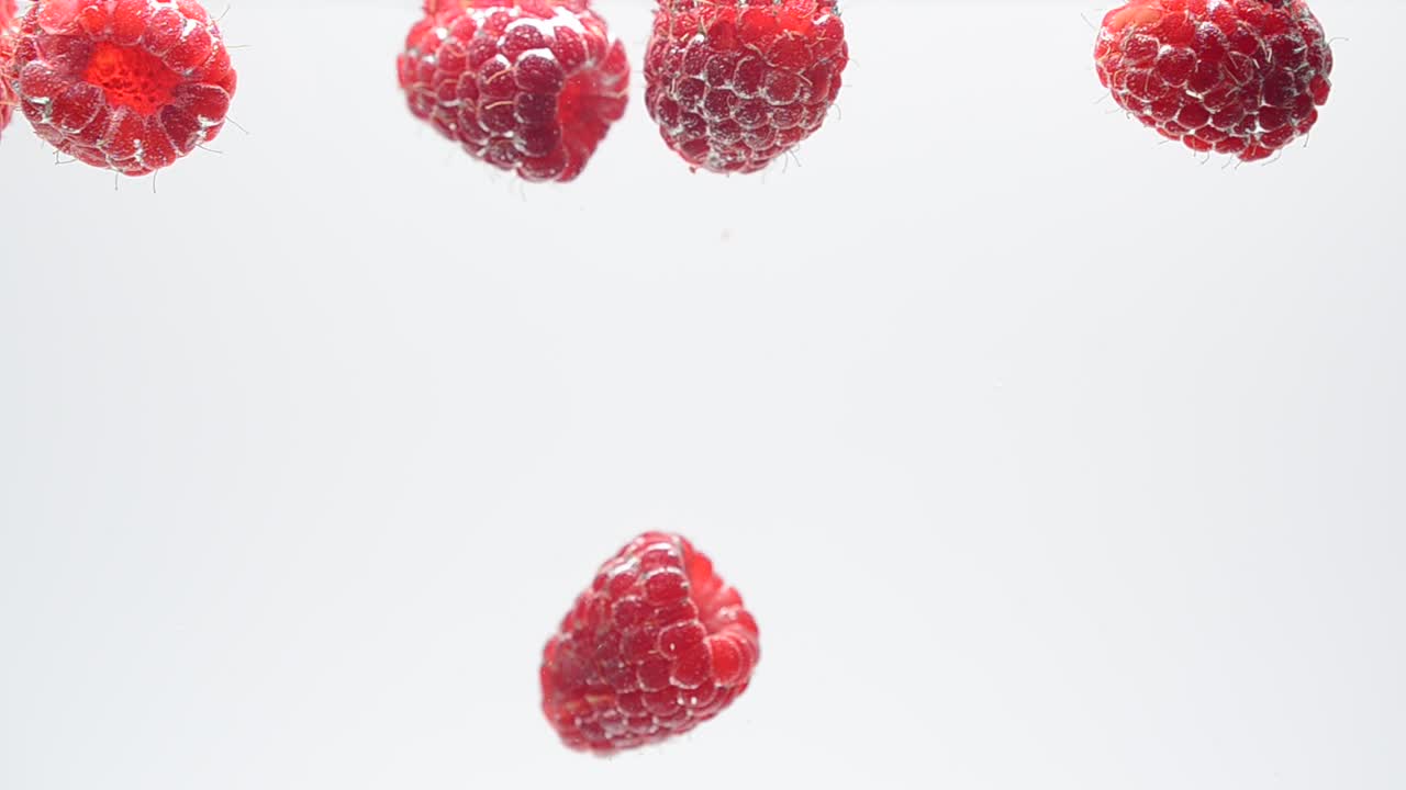 Raspberry on a white background. Shooting on a white background