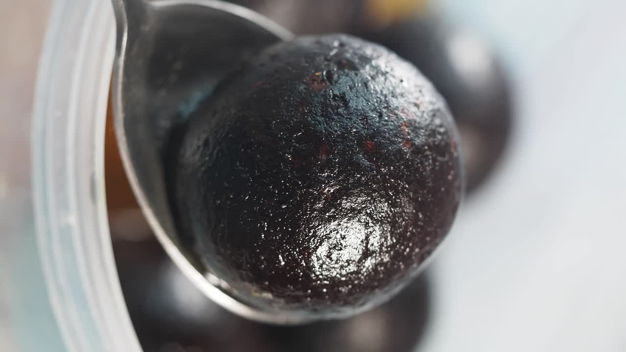Close-up of a Laddu on a Spoon