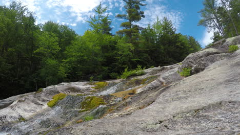 4k-stationary-shot-Maine-forest-wilderness-Stepp-Falls-Hiking-trail-area-filled-with-cascades-and-waterfalls-with-large-crystal-clear-pools-of-water-for-swimming