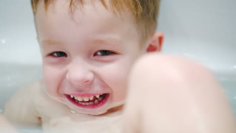 little laughing boy in the bath