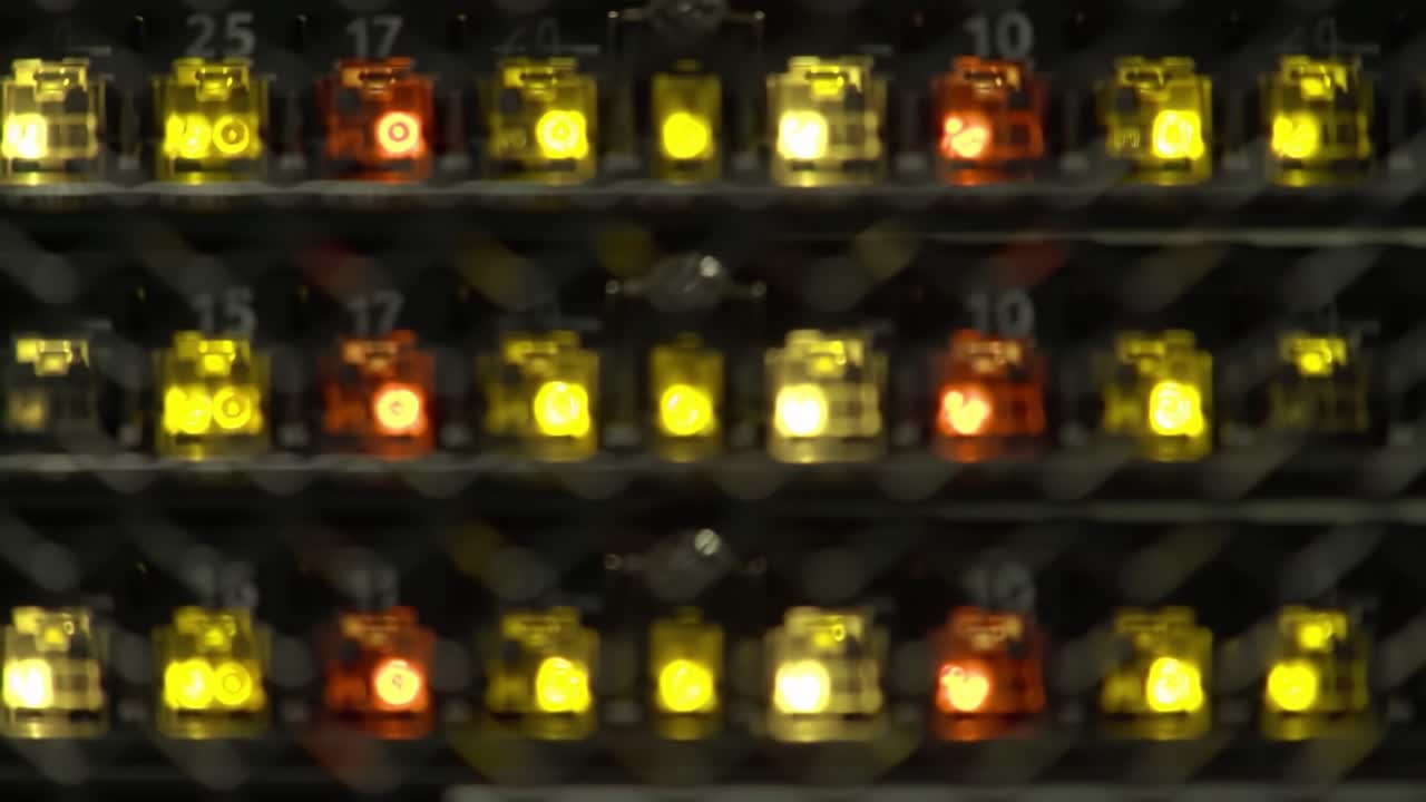 Intricate Network of Illuminated Connectors: A Close-Up View of Colorful LED Indicators in a Modern Electronic System Featuring a Blend of Warm and Cool Tones