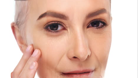 woman applying anti-aging cream