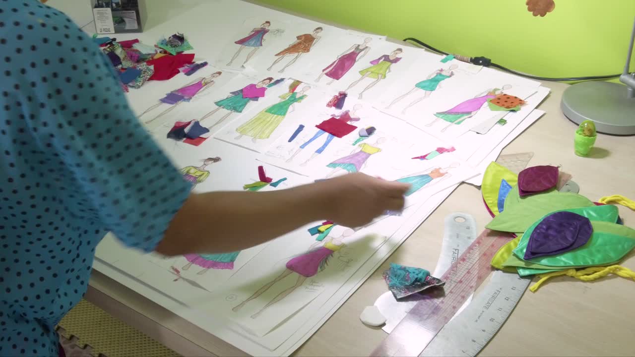Latin fashion designer working on new ideas for dresses