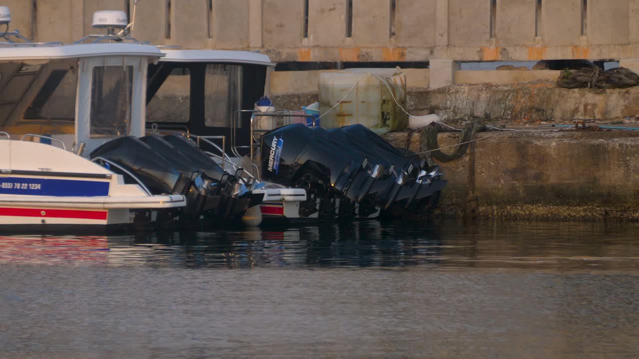 Ferry at the pier deck moored at marina, calm ocean water Phnom Penh Cambodia