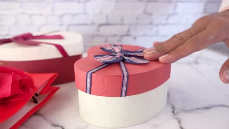 gift giving with heart-shaped boxes