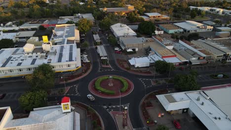 Drone-aerial-of-Mount-Isa-town-square-round-about-during-sunrise