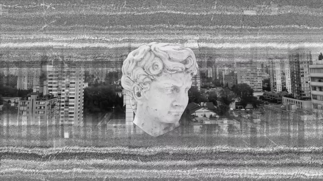 회색의 고통스러운 배경 위에 고대 머리 조각의 애니메이션