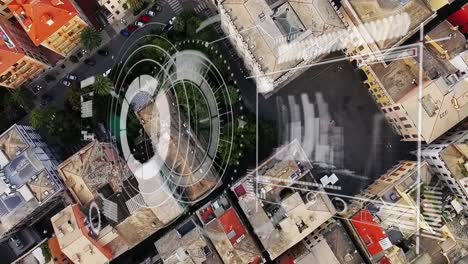 animation of loading circles, graphs and arrow over aerial view of modern city