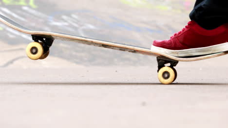 Young-skateboarder-skating-the-outdoor-skatepark