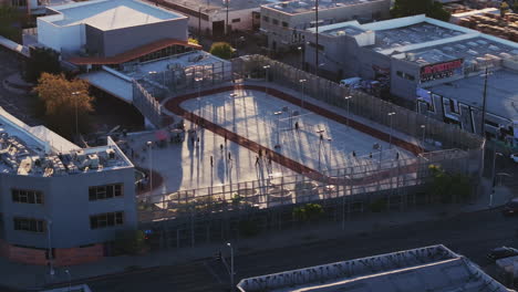aerial view of an urban multi-sport court with people playing