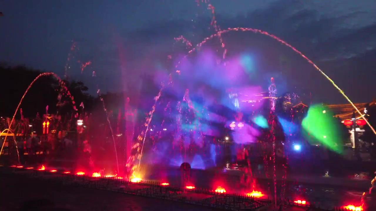 Amazing light and sound show in the fountains in the central town square at dusk in Xian, China
