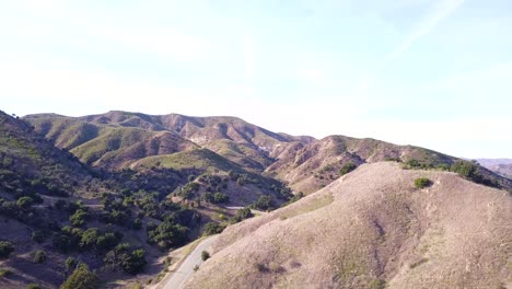 4k aerial drone shot of santa monica mountains in los angeles, california on a warm sunny spring day