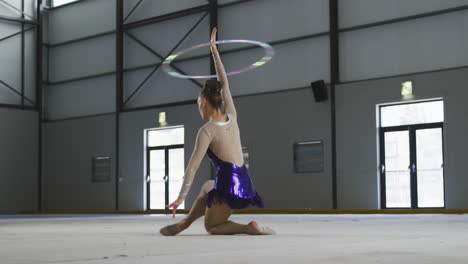 female gymnast performing at sports hall