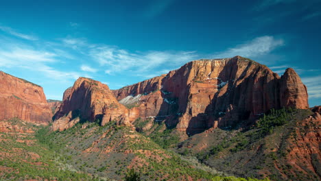 timelapse, zion national park utah usa kolob canyon, red cliffs, green vegetation and blue sky