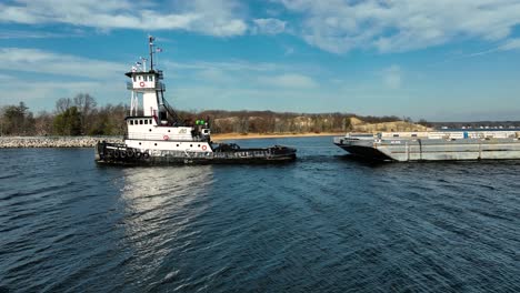 aerial rotation around boat keeping it in center frame as it heads out to sea