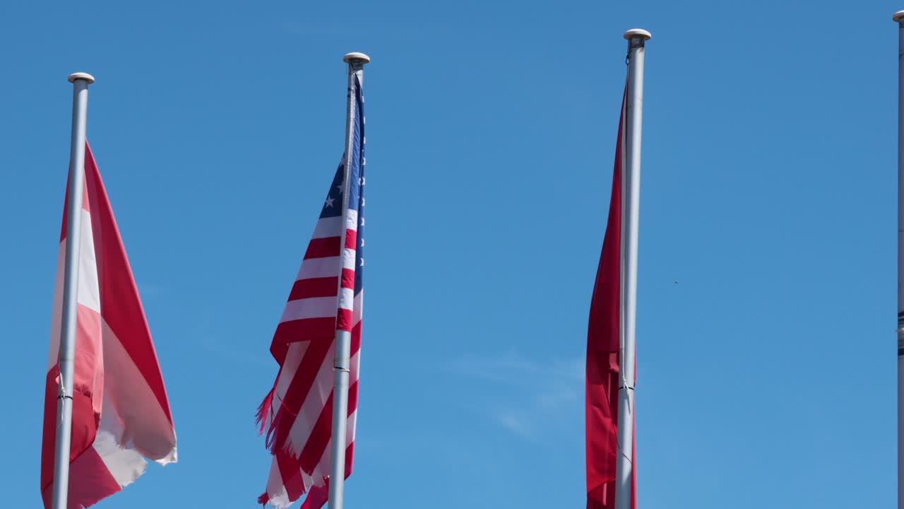 Flags of Austria and USA waving in wind