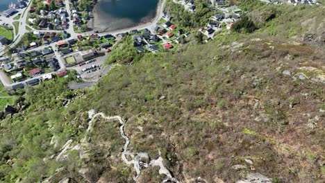 Aerial view follows the Sherpa hiking trail down the mountain above Svolvaer in Lofoten, Norway