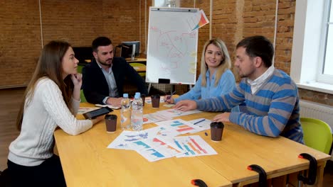 business team meeting involved diverse people participating in creative sustainable ideas steadicam shot across boardroom table shared work space