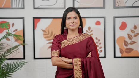 Confident-Indian-woman-standing-crossed-hands