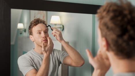 Handsome-man-massaging-his-head-with-a-mesoscooter