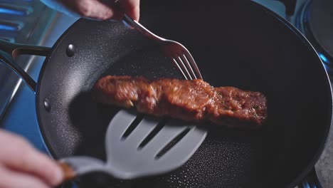 Flipping Ground Turkey Patty In Pan Using Slotted Turner And Fork